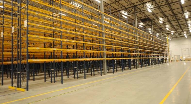 large warehouse with yellow shelving