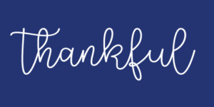 thankful in white on blue